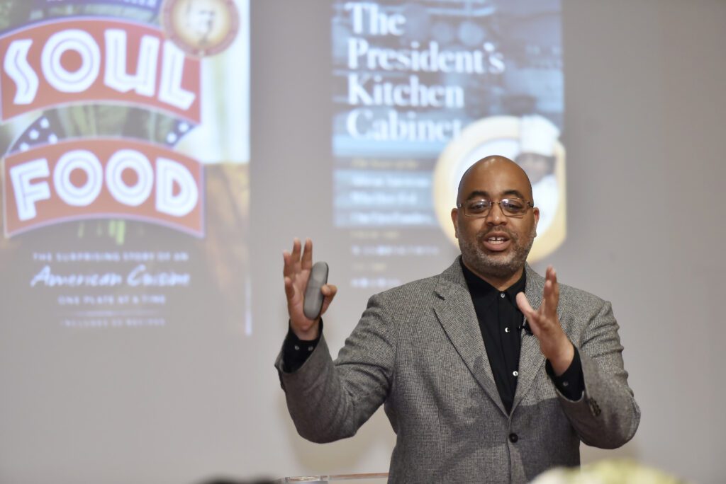 Adrian Miller giving a presentation on his first two books, Soul Food and The President's Kitchen Cabinet